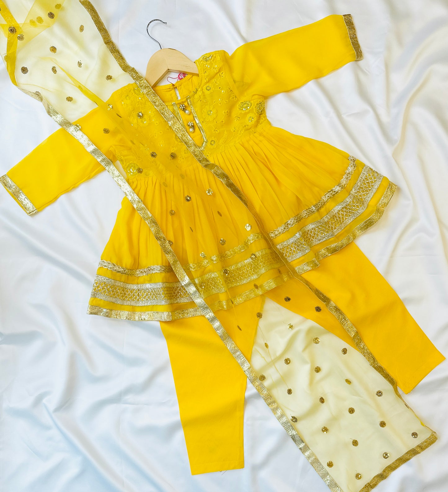 Girls frock and churidar dress for haldi and mayun celebrations.