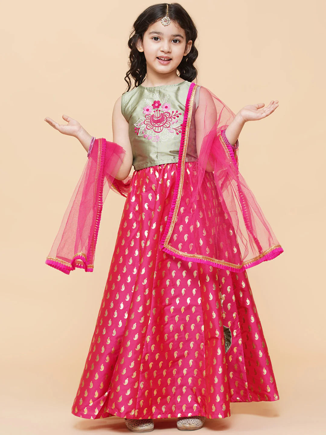Girls' hot pink silk lehenga, sage green embroidered choli, and net dupatta. Indian outfit, shop in Canada.